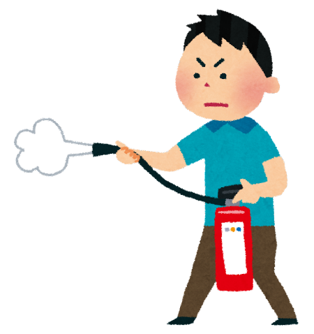 男の子が消火器を使用している画像。